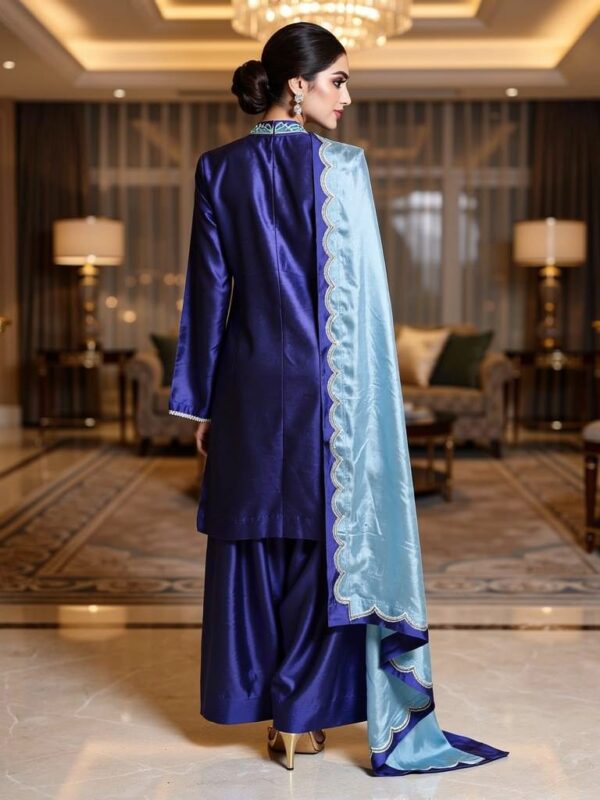 Back view of royal blue Pakistani formal dress with scalloped dupatta.