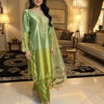 Elegant two-tone apple green pure sheesha silk suit with heavy hand embroidery.